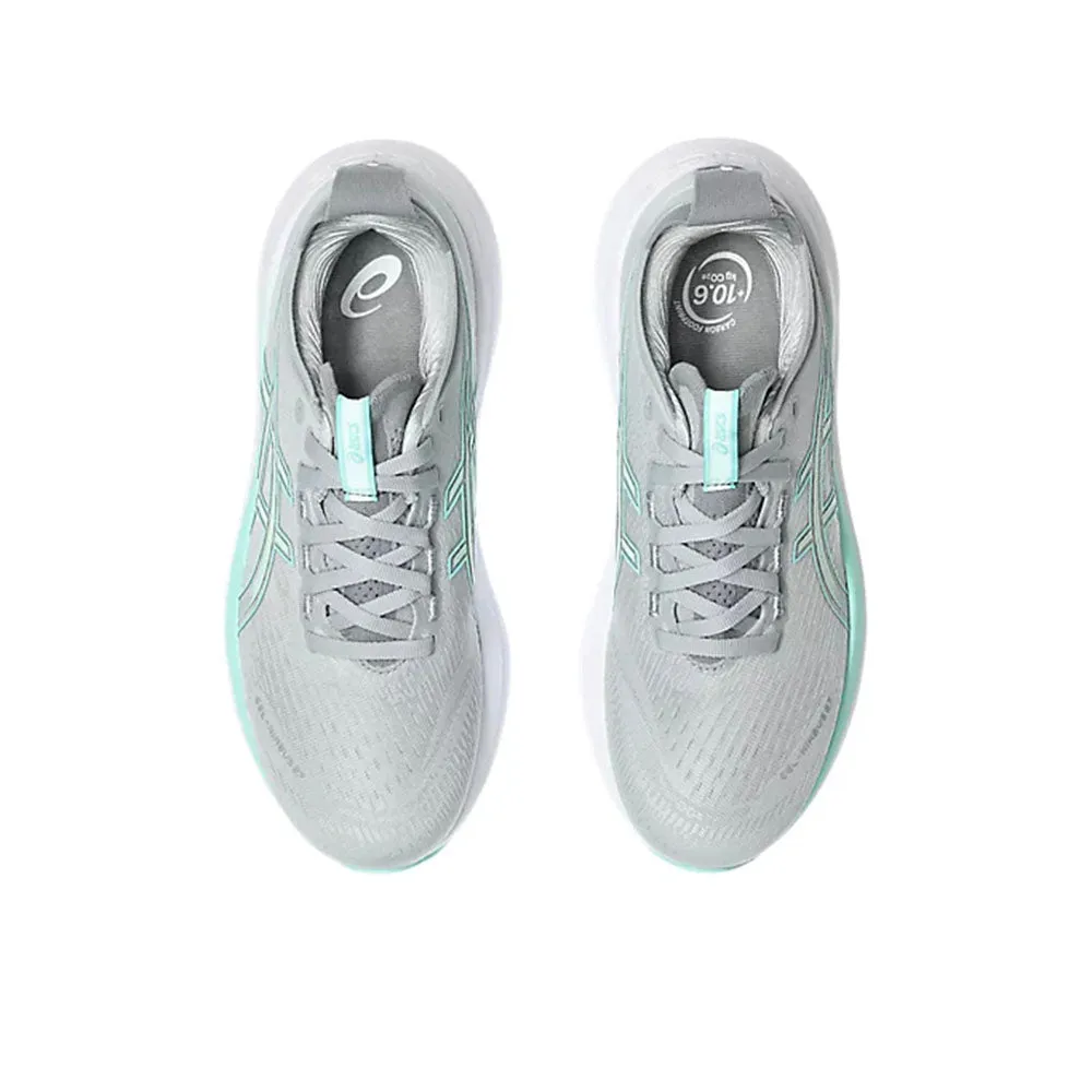 W Gel-Nimbus 27 (D) - Piedmont Grey/Illuminate Mint running with a safety light