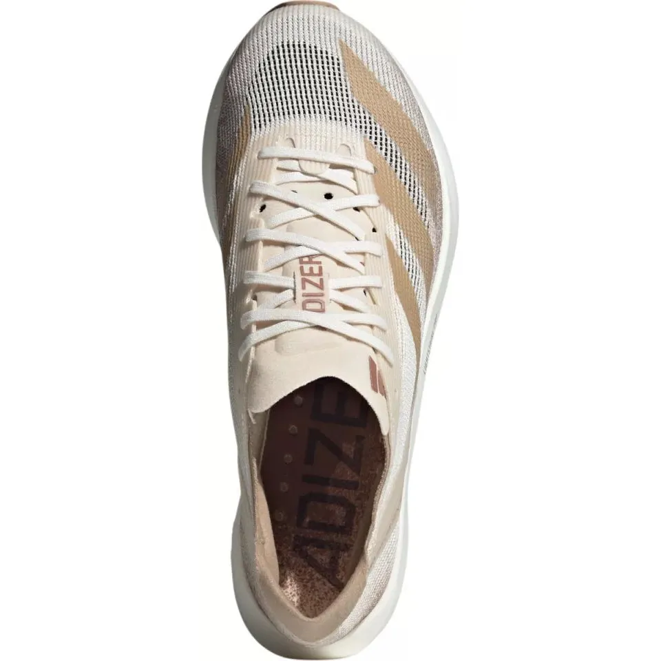 running in a city park shoes Recycled Components Women's Adizero Takumi Sen 10 Beige / Warm Sandstone / Halo Ivory